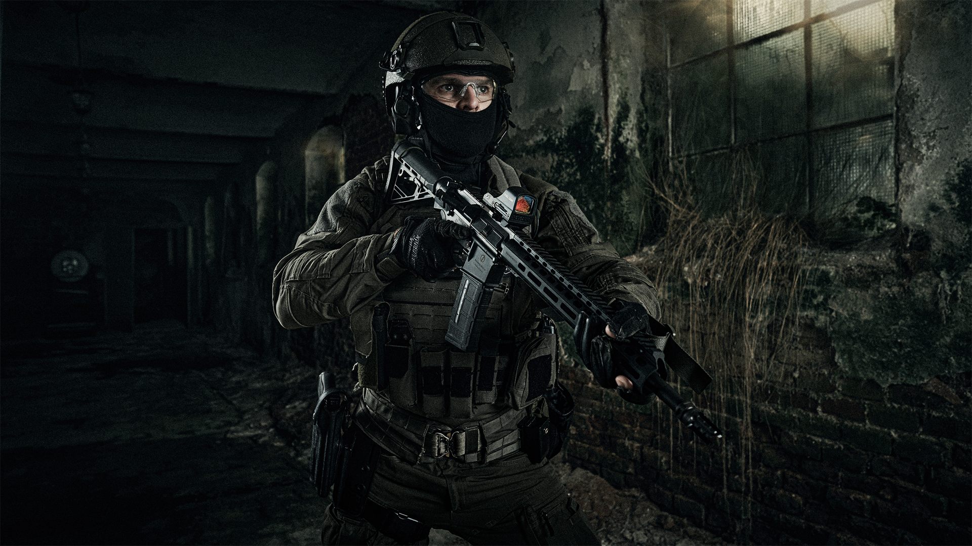 Operator with a Schmeisser rifle and HOLOSUN sight in a derelict industrial hall