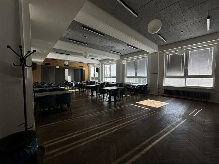 Conference hall laid out with tables