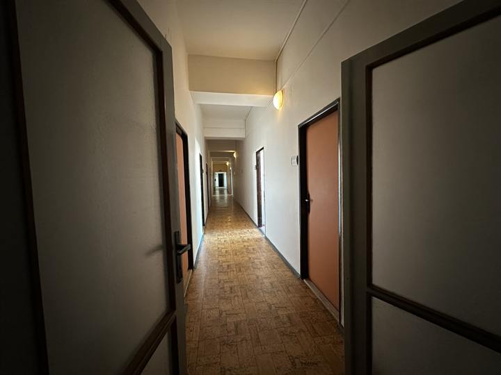 Office corridor with doors along both sides