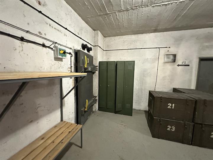 Store room with steel lockers and numbered crates