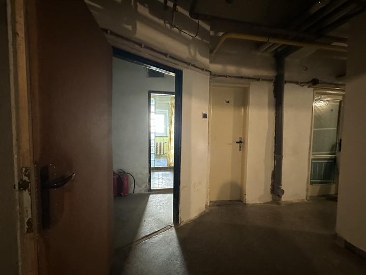 Basement doors and exposed service pipework