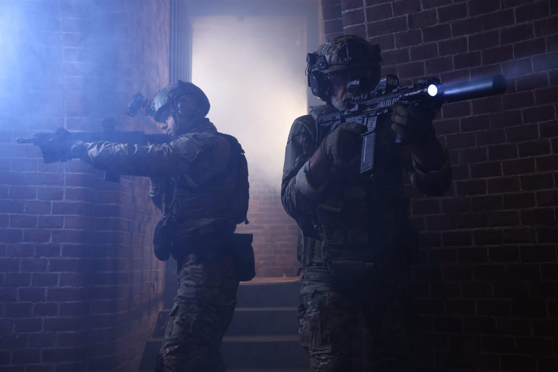 Police intervention team with weapon lights in an underground vault